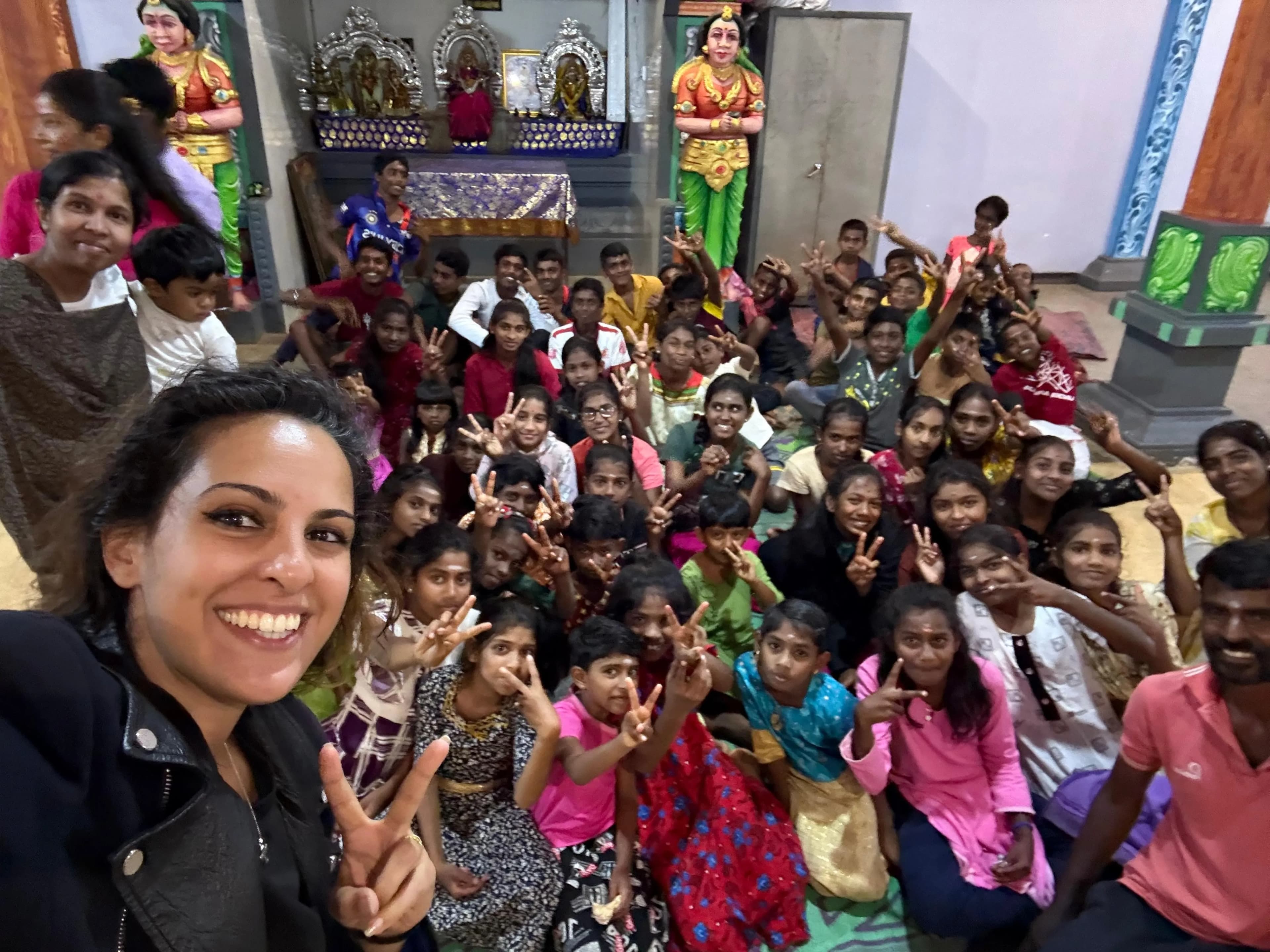 Infinite Grace Foundation volunteers with a large group of children and young people they work with.